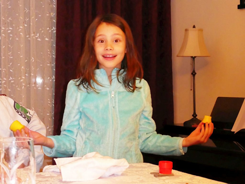 Stephie demonstrating a magic trick