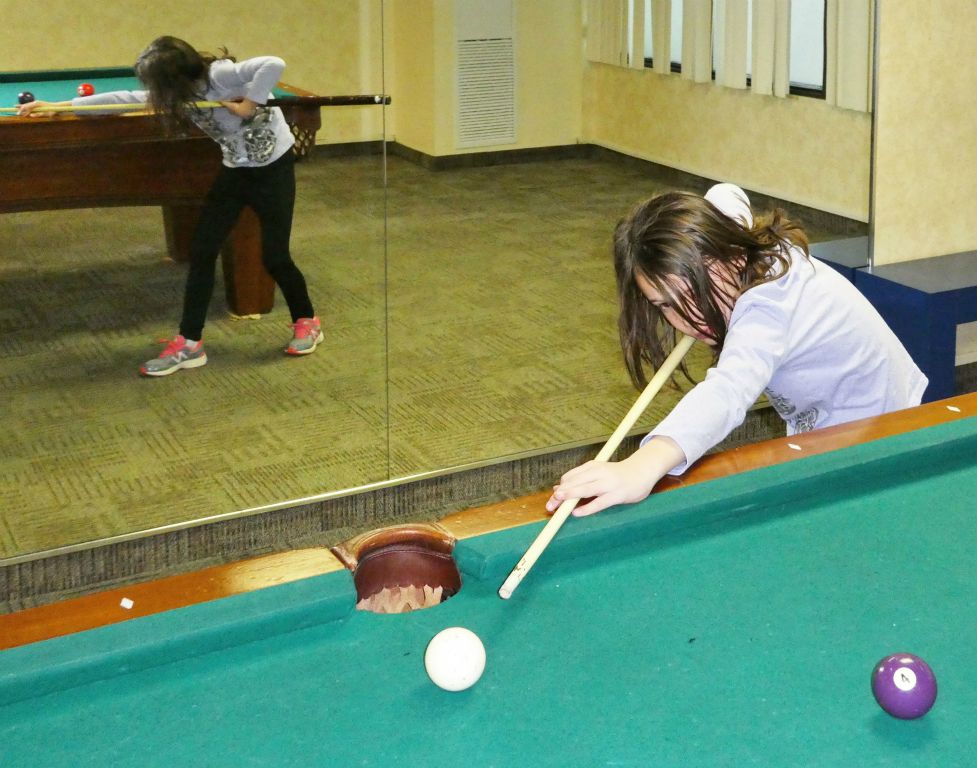 Stephie demonstrating her billiards skills